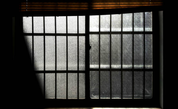 istock Patterned old glass windows, the morning sun shines in 1294971724