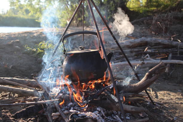 istock the hearth with a pot boils on fire hiking in nature 1294973521