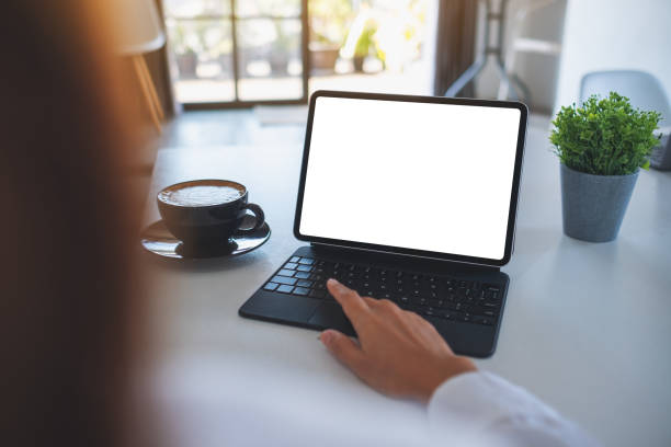 istock a business woman using and touching on tablet touchpad with blank white desktop screen as a computer pc 1294974315