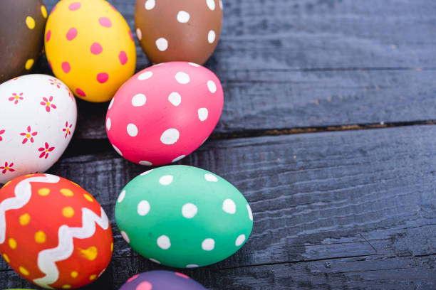 istock Easter eggs top view on black wooden background 1294974324