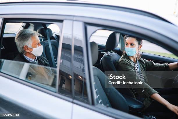 Female Rideshare Driver In Times Of The Pandemic Stock Photo - Download Image Now - Crowdsourced Taxi, Car Pooling, Driving