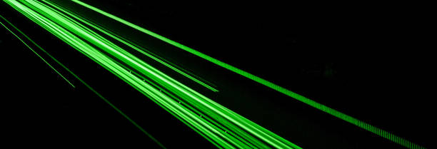istock green car lights at night. long exposure 1294976114