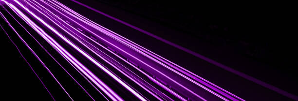 istock violet car lights at night. long exposure 1294976130