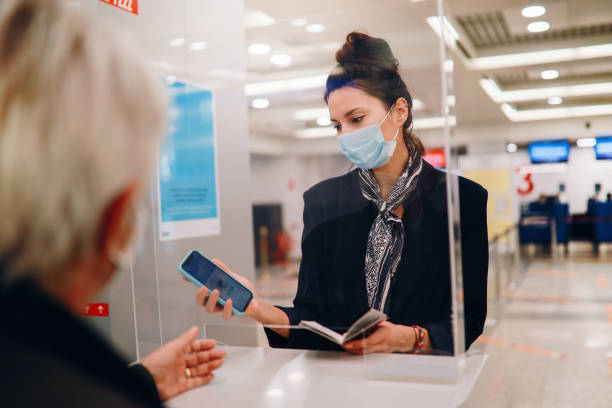 istock Handling agent at the airport checking covid passport 1294976735