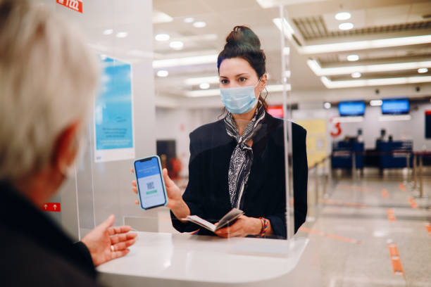 Handling agent at the airport checking covid passport