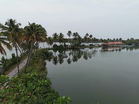 The Kerala backwaters are a network of brackish lagoons and lakes lying parallel to the Arabian Sea coast of Kerala state in southern India, as well as interconnected canals, rivers, and inlets, a labyrinthine system formed by more than 900 kilometres of waterways, and sometimes compared to American bayous.