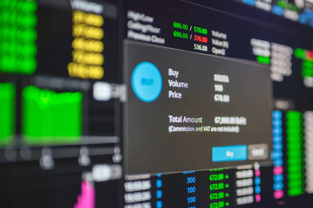 istock Online trading Investor using smart phone seclective buying cryptocurrency and stock through a mobile app 1294977628