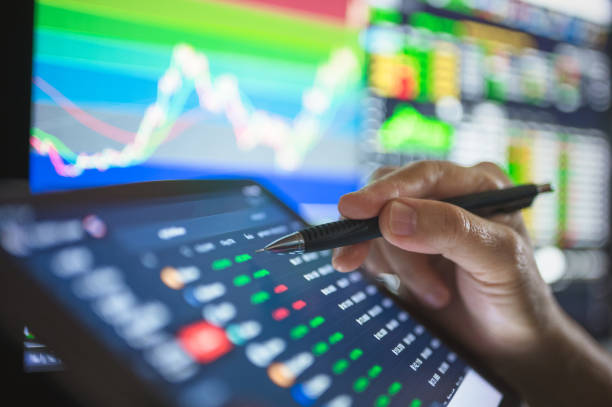 istock Businesssman using Chart and graph to trading in stock and cryptocurrency after blobal businesss going to bullmarket after Recession 1294977632