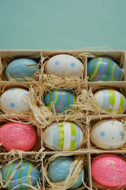 istock Easter holiday. Easter colorful eggs set in a box on a light green mint background.Spring festive easter background.Easter symbol. 1294979811
