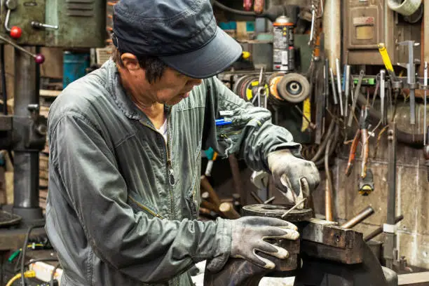 Photo of Craftsmen of the ironworks in the downtown area doing their best.