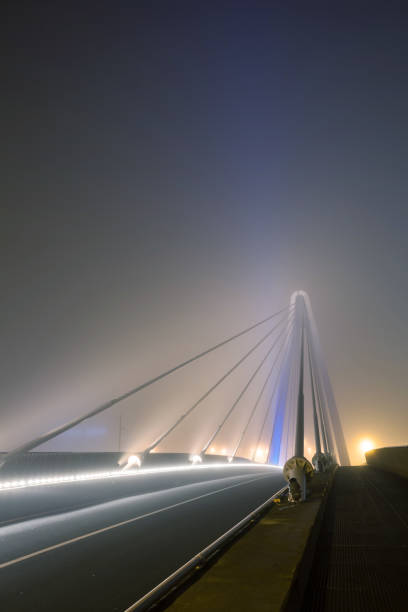 istock bridge over water whit fog 1294983559