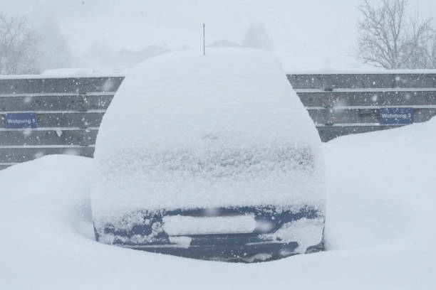 istock car covered in snow on winter day 1294985089