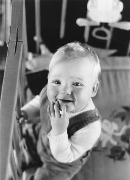 Retro vintage child in a playpen