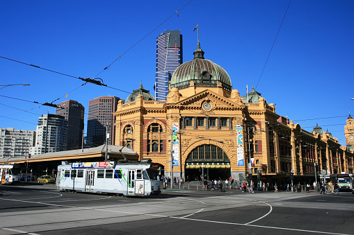Melbourne, Australia - March 19, 2012: View of iconic Flinders Street Station and a vintage tram in Melbourne city cetre, Victoria, Australia