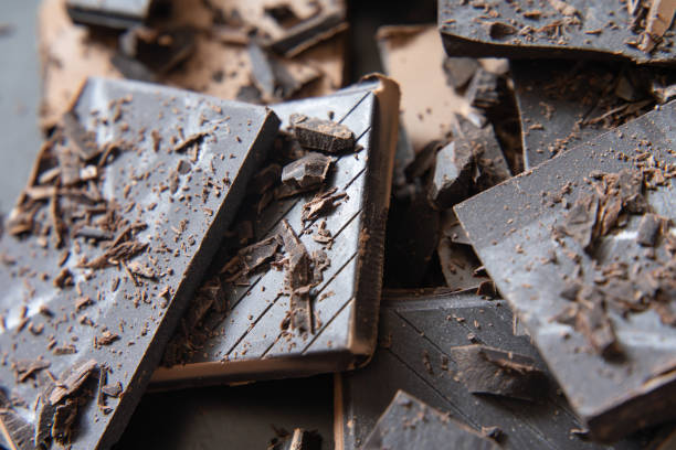 istock Delicious dark chocolate on black dish 1294991144