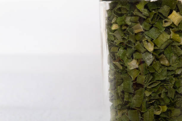 istock close up of kitchen spices in a glass container on a white background 1294991898