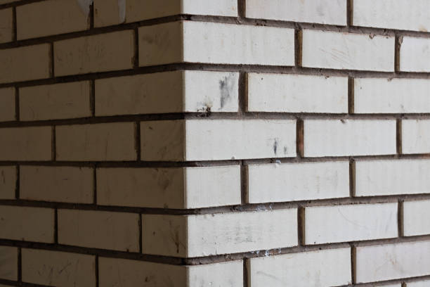 Close up corner of a brick building, background or texture