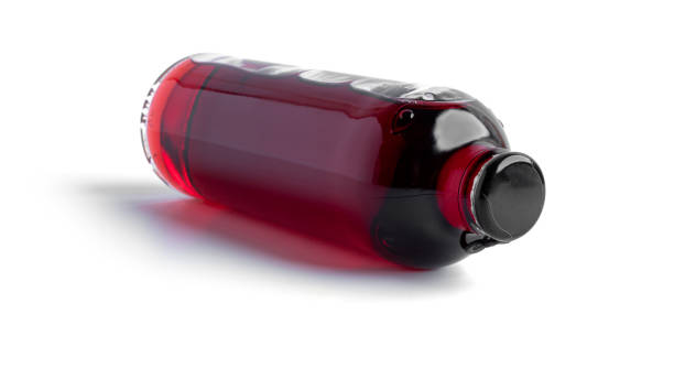 istock Cherry alcoholic drink in a bottle isolated on a white background 1294993788