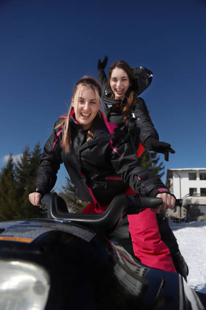 istock Women driving snowmobile 1294994734