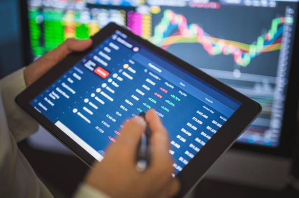 istock Online port invest checking investing portfolio select cryptocurrencies and using online trading during coronavirus crisis work from home. 1294997263