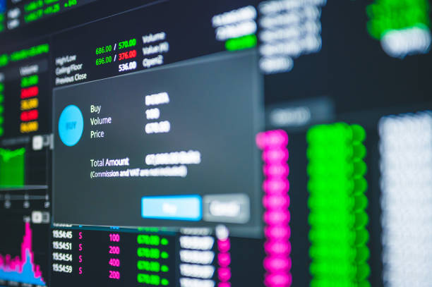 istock Online trading seclective buying cryptocurrency and stock through a mobile app and analysis with chart during recession covid-19 crisis 1294997321