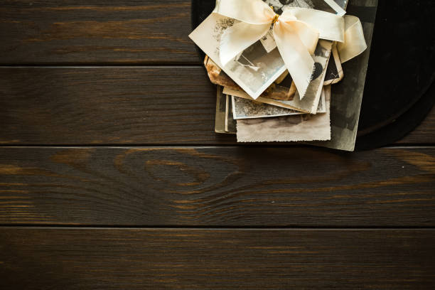 istock Antique photos on wooden board 1294998001