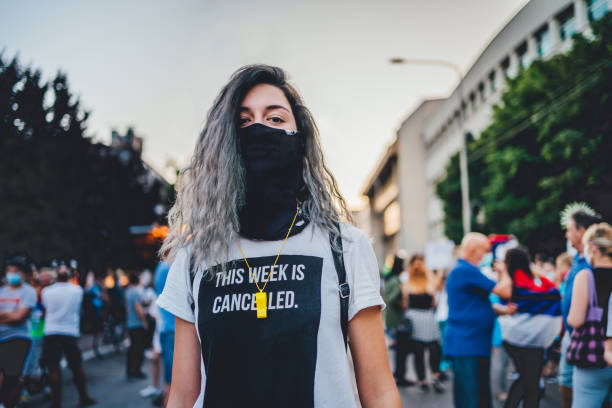 istock Young female protester in the street 1295003949