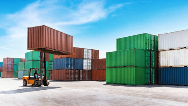 istock Container stacking cargo with forklift truck working in shipping harbor. Logistics export import Business concept. 1295004174