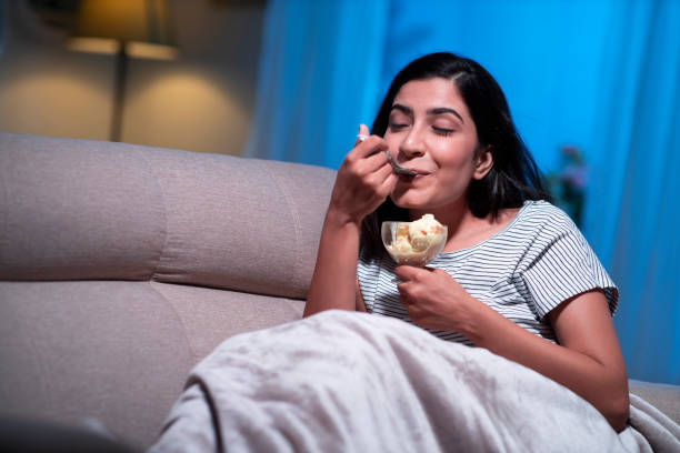 istock young women at home sitting on sofa 1295005091