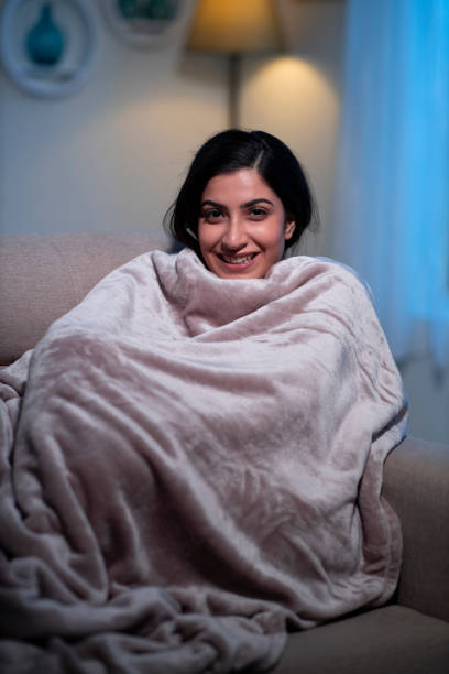 istock young women at home sitting on sofa 1295005512
