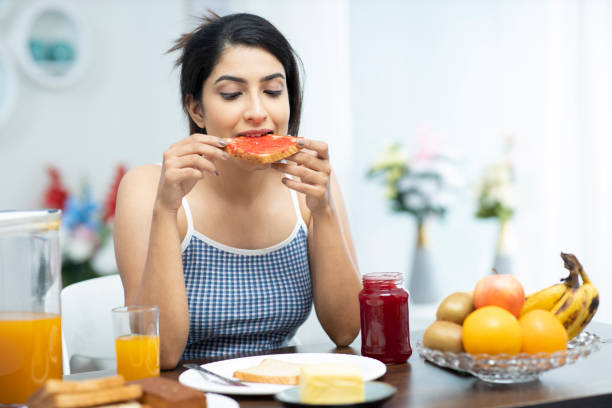 istock young women having breakfast - stock Photo 1295008630