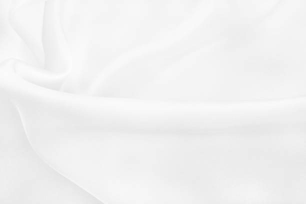 istock White fabric cloth texture for background and design art work, beautiful crumpled pattern of silk or linen. 1295008946