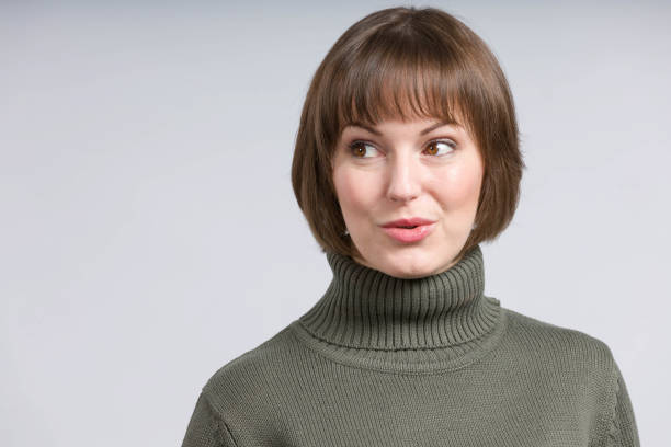 istock young woman shows surprised emotional expressions 1295009018