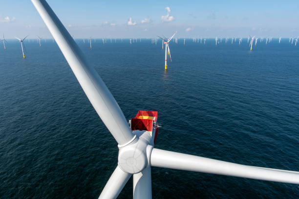 Alternative energy. Aerial view of offshore windmill park at Sea. offshore wind farm stock pictures, royalty-free photos & images
