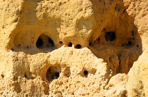 Algar Seco, Carvoeiro, Lagoa, Algarve / Faro district, Portugal: holes in the eroded cliffs above the Atlantic Ocean.