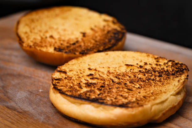 istock Brioche bun freshly toasted on a pan 1295016008