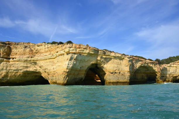Benagil Cave arches seen from the sea (Algar de Benagil), Lagoa, Algarve, Portugal Lagoa, Algarve / Faro district, Portugal: arches of Benagil Cave - a grotto created by the erosion of the colourful sedimentary rocks by the waters of the Atlantic Ocean, creating a dome and several arches, like a cathedral - Algar de Benagil. algar de benagil photos stock pictures, royalty-free photos & images