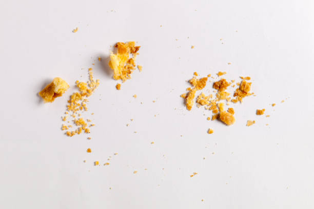 istock Scattered crumbs isolated on white background 1295018703
