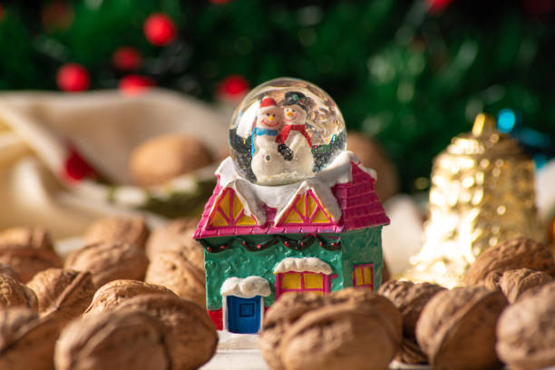 istock Christmas, Christmas ornaments and nuts on a table with cream towel, selective focus. 1295020630