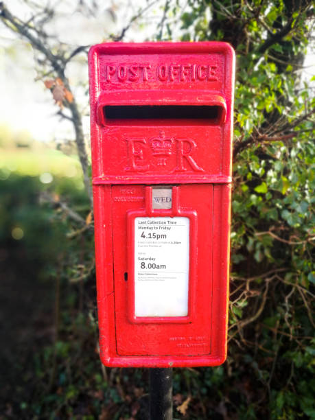 istock Traditional British red public mailbox in the countryside 1295021044