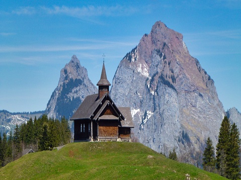 small tiny church in front of high mountains, Mythen, Stoss Switzerland
