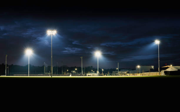 istock Empty small town high school football ground lighted at night 1295021998