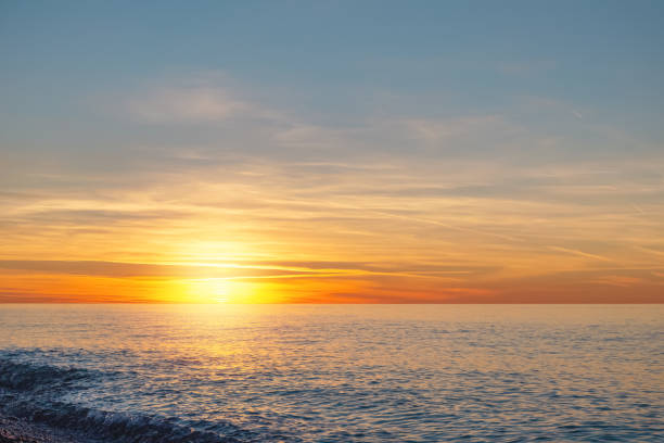 istock Bright sunset cloudscape over the sea 1295022290