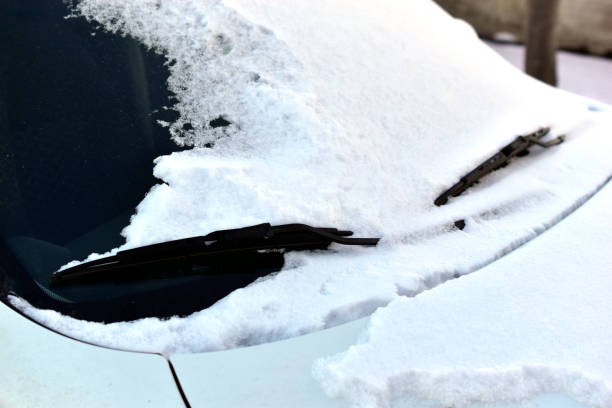istock The snow-capped white car in the winter 1295023446