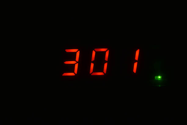 istock Red numbers on the display in the dark 1295024286