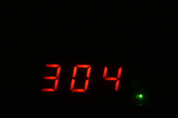 istock Red numbers on the display in the dark 1295024342
