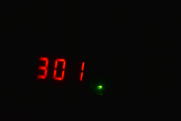 istock Red numbers on the display in the dark 1295024343