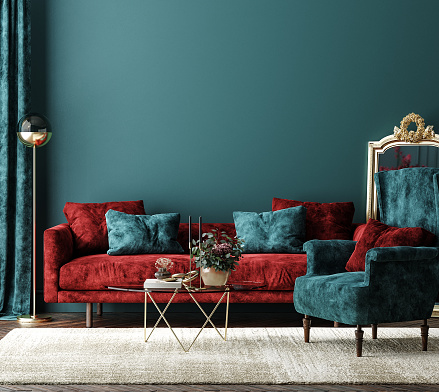 Maqueta interior del hogar con sofá rojo, mesa y decoración en sala de estar verde photo