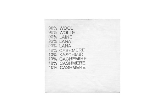 Fabric composition clothing label in different languages isolated over white