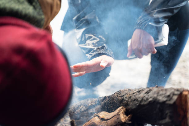 istock campfire winter night in the forest, fire baking and warm cozy concept 1295030284